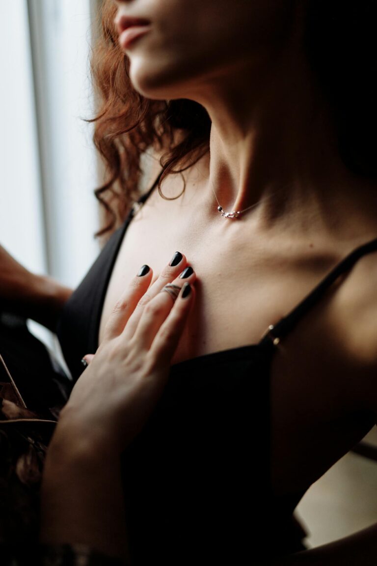 Close-up of two women sharing an intimate and sensual moment indoors.